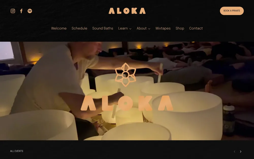 The aloka.org homepage: the Aloka wordmark in copper over a candlelit session