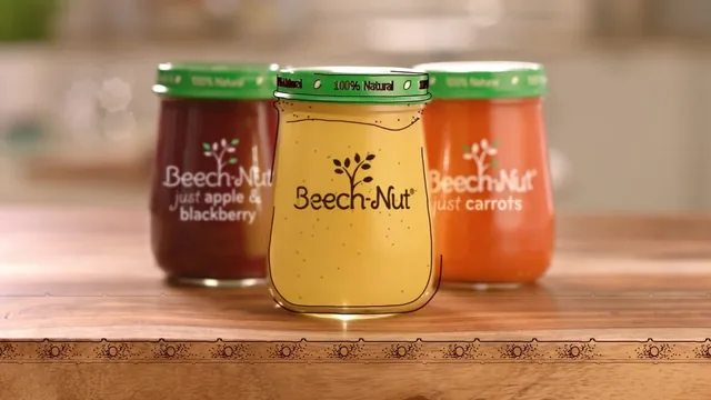 Three Beech-Nut glass jars on a wooden table, just apple & blackberry, a yellow puree traced in drawn lines and just carrots, on a drawn conveyor belt