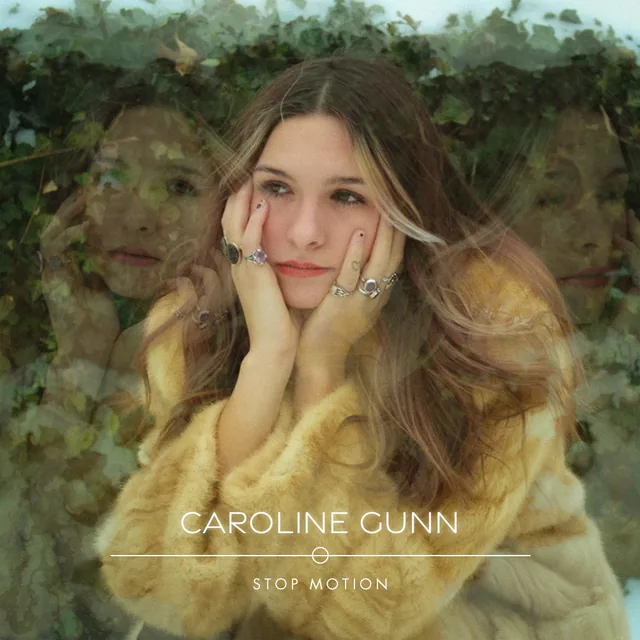 A young woman in a fur coat rests her face in her hands, with fainter copies of her face on either side and ivy above. CAROLINE GUNN in fine capitals over a thin line broken by a small circle, with STOP MOTION below