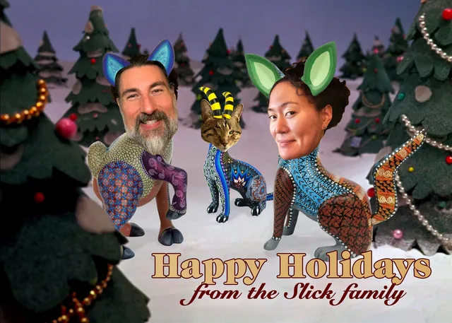 Graham’s and his wife’s faces on two painted folk-art animals in a stop-motion snow scene, with Happy Holidays from the Slick family
