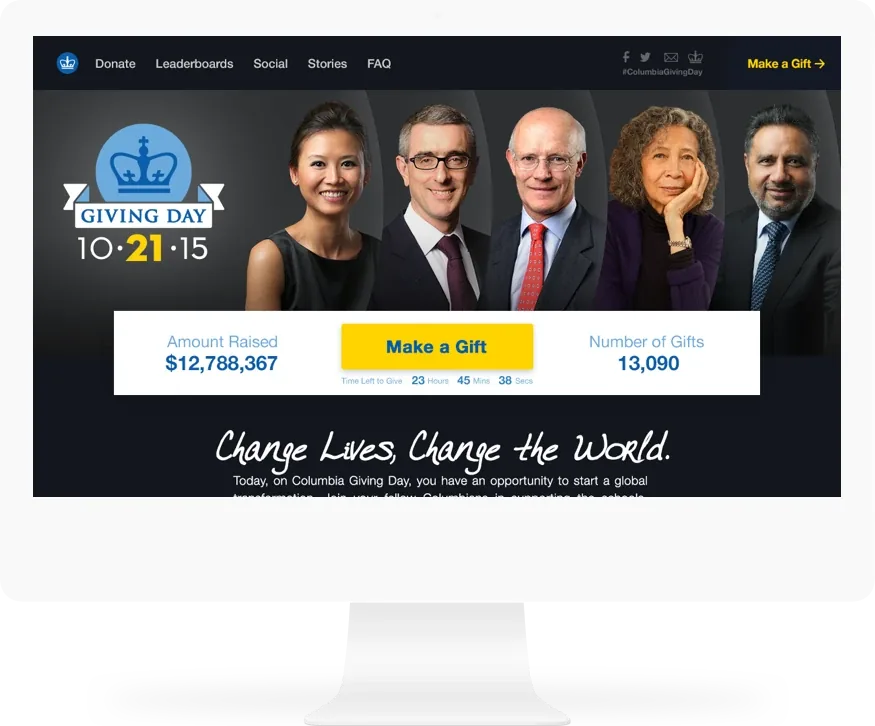 Columbia Giving Day on a desktop monitor: five portraits, the running total of $12,788,367 and a make a gift button