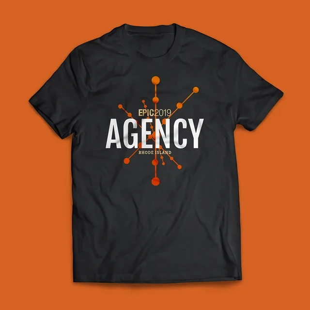 A black T-shirt on an orange ground, printed with EPIC2019 in gold, AGENCY in white capitals and Rhode Island, over orange lines and dots like a network