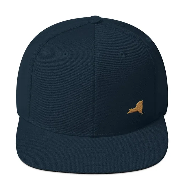 The same dark navy snapback with the outline of New York State embroidered in old-gold thread