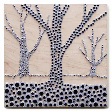 Three bare trees made of googly eyes, standing on a ground of larger eyes