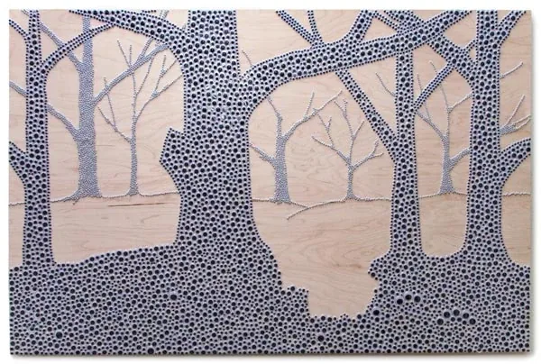 Trees over a ravine, made of googly eyes on light wood