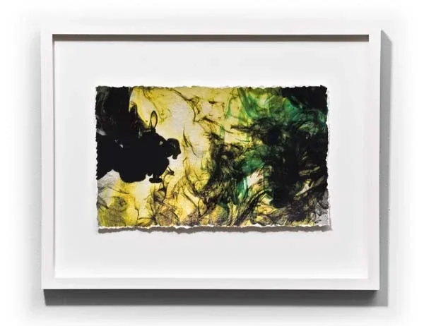 Yellow, green and black clouds on a deckled sheet, framed