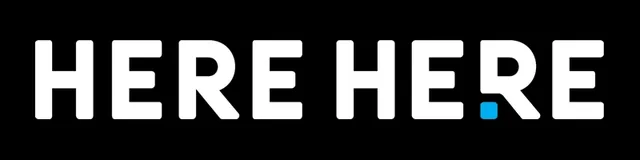 The Here Here logo: HERE HERE in white capitals, with a blue square before the last R, as in its address, herehe.re