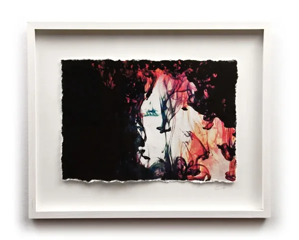 A framed print in black, white and pink