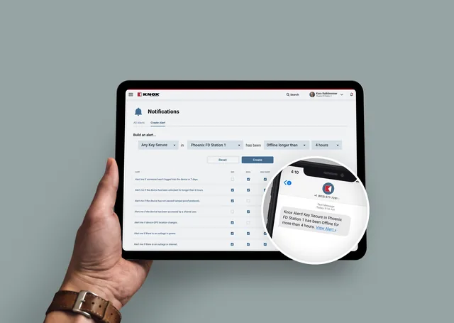 A hand holds a tablet on the Knox Notifications page, building an alert: any Key Secure in Phoenix FD Station 1 has been offline longer than 4 hours. A zoomed-in phone shows the text it sends: Knox Alert! Key Secure in Phoenix FD Station 1 has been Offline for more than 4 hours.