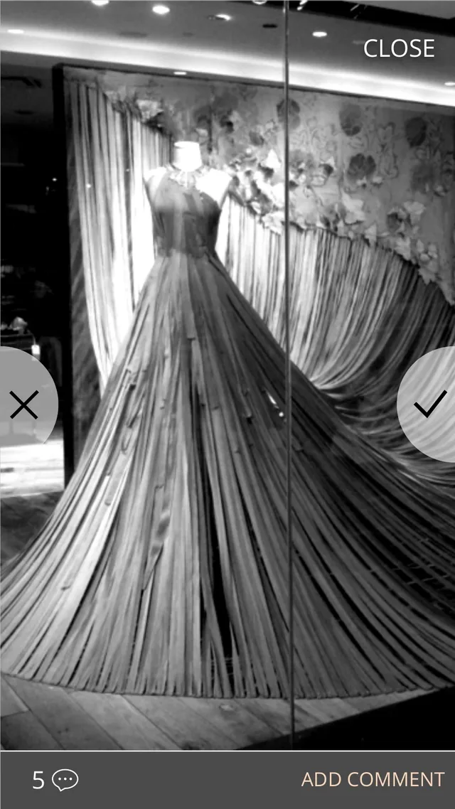 Wireframe of a single photo, a gown in a shop window, shown full screen with a cross to decline on the left, a check to approve on the right, a close button, and five comments with a link to add one
