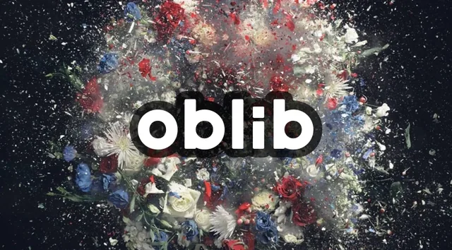 The oblib logo in bold white lowercase over an explosion of flowers and shards