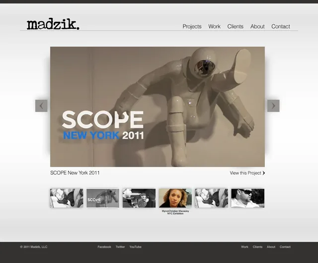 An earlier homepage comp built around film: a video still of a white sculpture of an astronaut climbing a wall, titled SCOPE New York 2011, above a row of film thumbnails