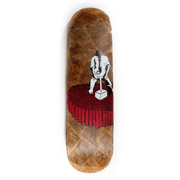 A skateboard deck: a figure sitting on a red block