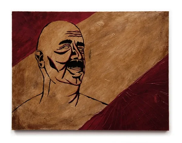 A bald man with a mustache and closed eyes under a dark red band
