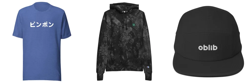 Three PØNG pieces: a blue T-shirt that reads ピンポン, ping pong in Japanese; a black tie-dye PØNG hoodie; a black oblib five-panel hat