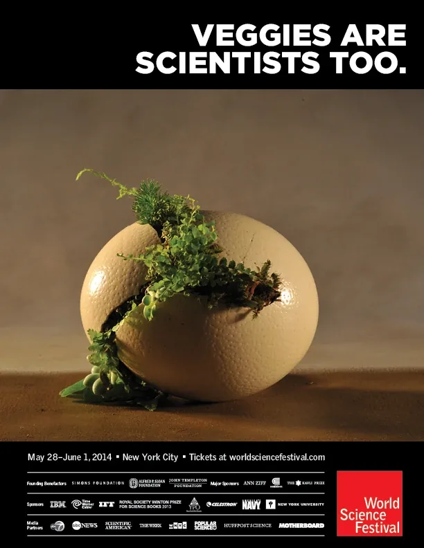 A cracked egg sprouting greens on a warm brown ground, under Veggies are scientists too. in white capitals