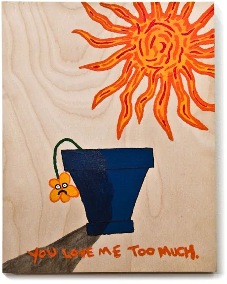 A flower in a blue pot under a blazing orange sun